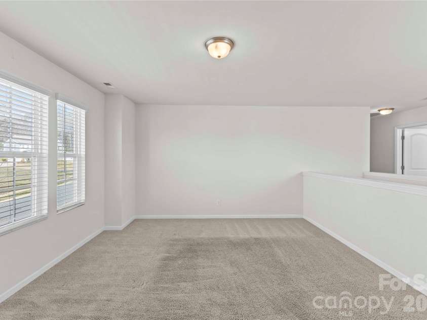 9032 Willowfield Drive, Charlotte, NC 28269.  MLS# CAR4345914, YatesRealty ID 12003. Spacious loft