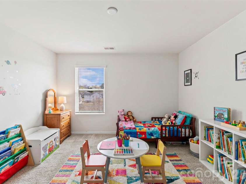 9032 Willowfield Drive, Charlotte, NC 28269.  MLS# CAR4345914, YatesRealty ID 12003. Virtually staged bed 5/playroom