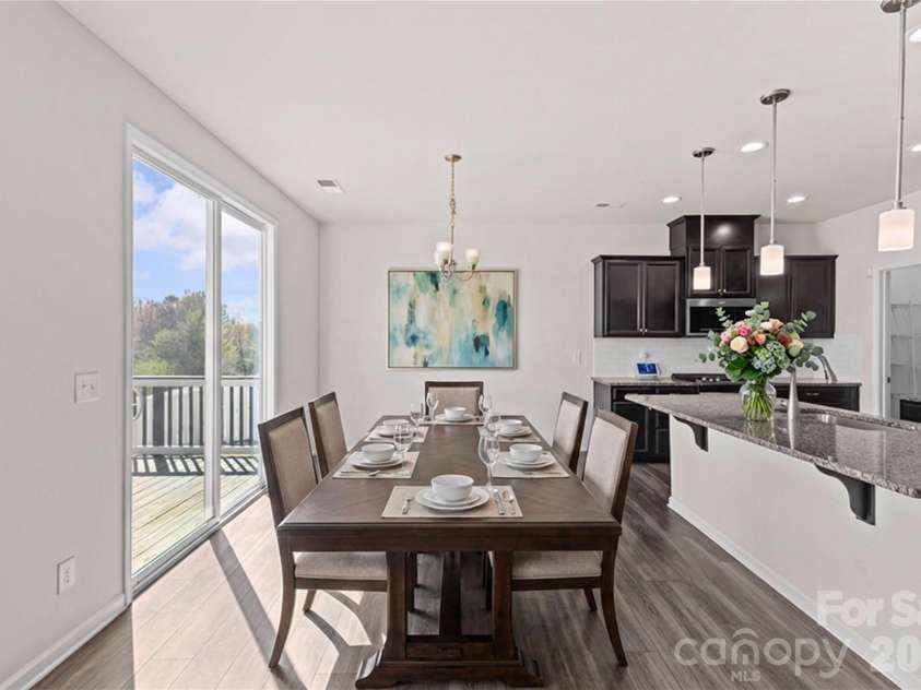 9032 Willowfield Drive, Charlotte, NC 28269.  MLS# CAR4345914, YatesRealty ID 12003. Virtually staged dining area