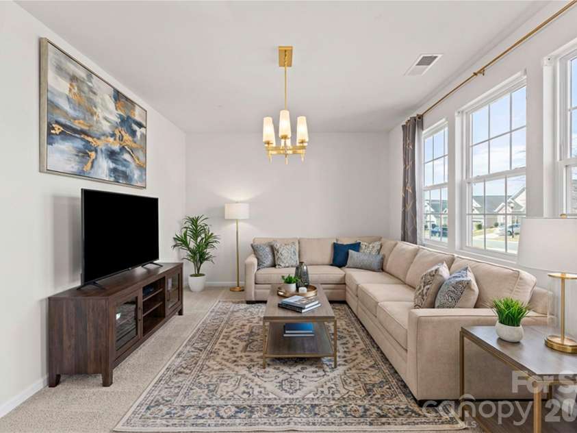 9032 Willowfield Drive, Charlotte, NC 28269.  MLS# CAR4345914, YatesRealty ID 12003. Virtually staged living room/flex space