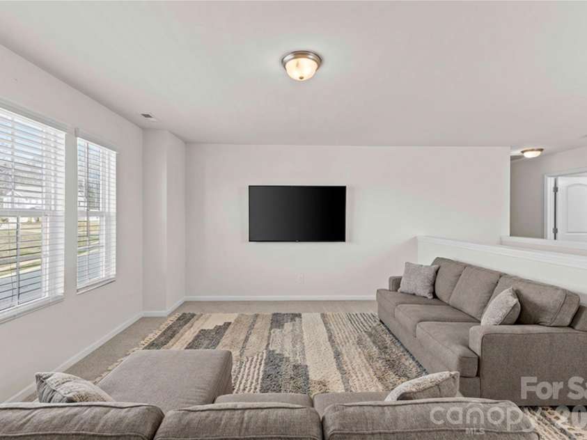 9032 Willowfield Drive, Charlotte, NC 28269.  MLS# CAR4345914, YatesRealty ID 12003. Virtually staged loft