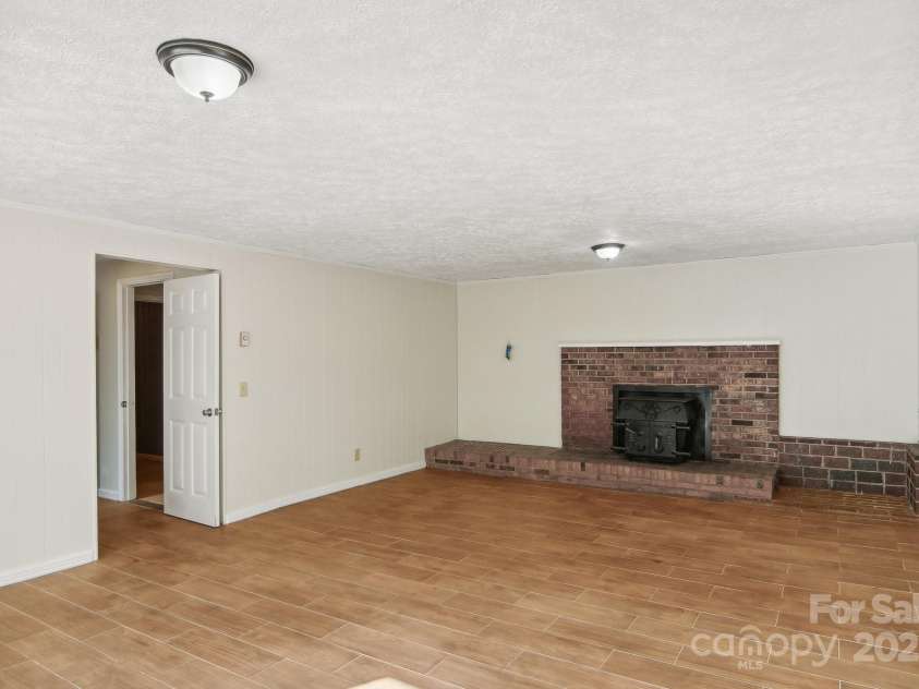 821 Anne Avenue, Hendersonville, NC 28739.  MLS# CAR4197377, YatesRealty ID 12006. Downstairs fireplace and living space