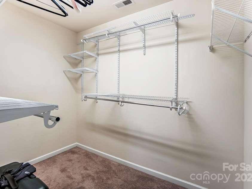 4224 Park South Station Boulevard, Charlotte, NC 28210.  MLS# CAR4227871, YatesRealty ID 12007. Primary Bedroom walk-in closet