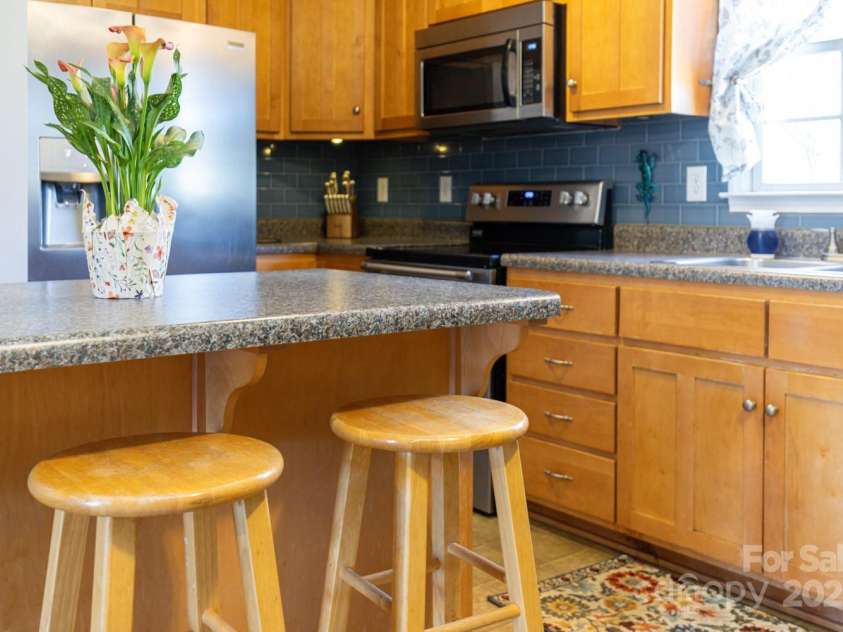 122 Ramsey Road, Asheville, NC 28806.  MLS# CAR4233927, YatesRealty ID 12010. The kitchen is well-appointed with a central island