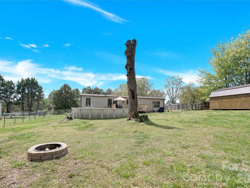 3770 Macklin Street, Claremont, NC 28610.  MLS# CAR4365332, YatesRealty ID 12010. Firepit in the back yard.