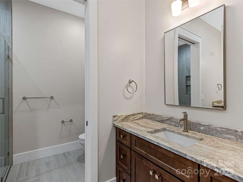 435 Barrington Drive, Asheville, NC 28803.  MLS# CAR4235274, YatesRealty ID 12013. Basement full bath #