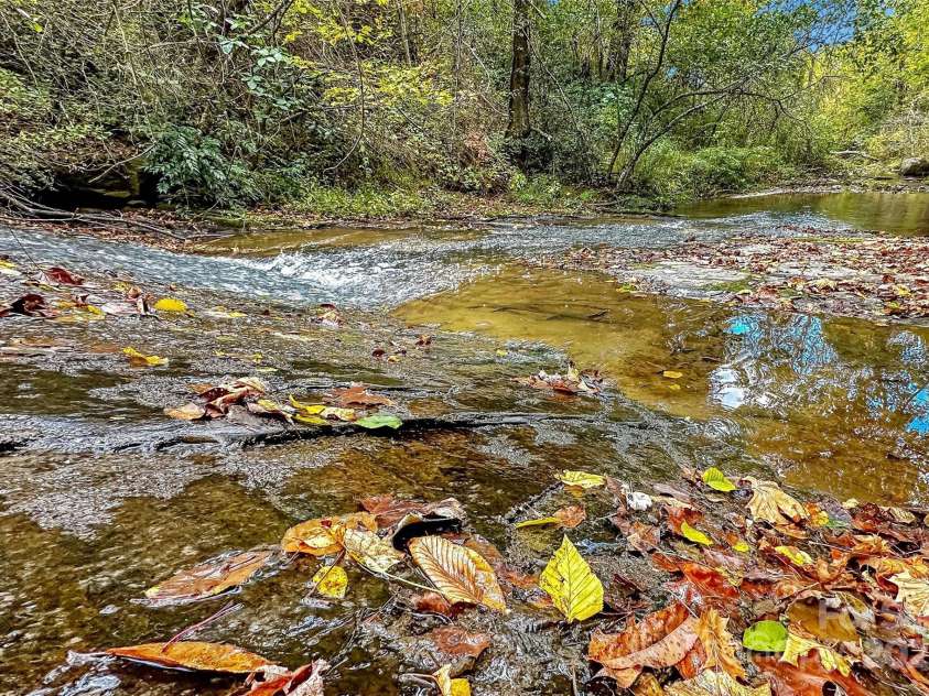 2517 Pine Cove Road, Old Fort, NC 28762.  MLS# CAR4249104, YatesRealty ID 12014. Waterfall at the swimming area