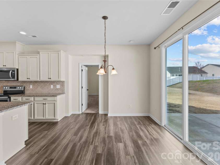 7512 Meridale Forest Drive, Charlotte, NC 28269.  MLS# CAR4346569, YatesRealty ID 12014. Breakfast Area w/Access to Patio