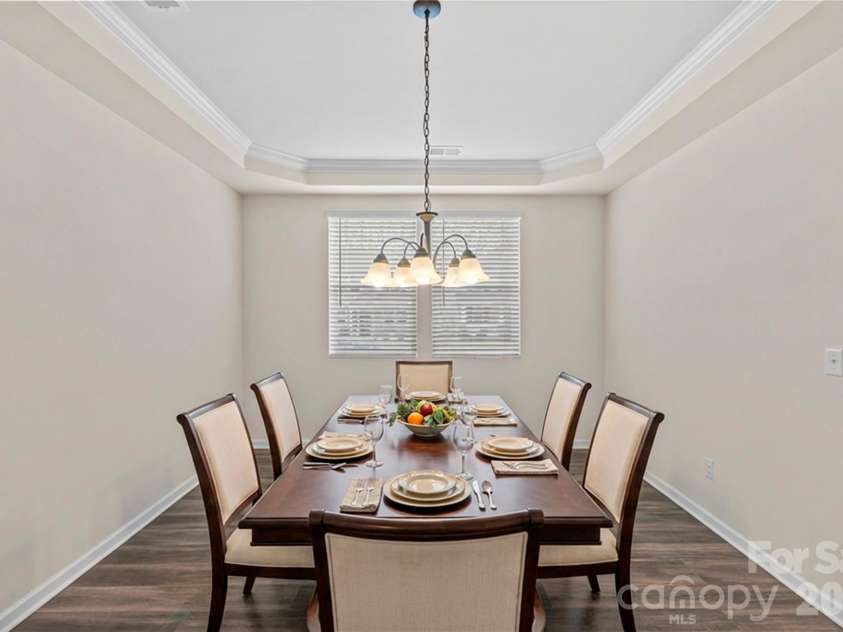 7512 Meridale Forest Drive, Charlotte, NC 28269.  MLS# CAR4346569, YatesRealty ID 12014. Dining Area_ Virtually Staged