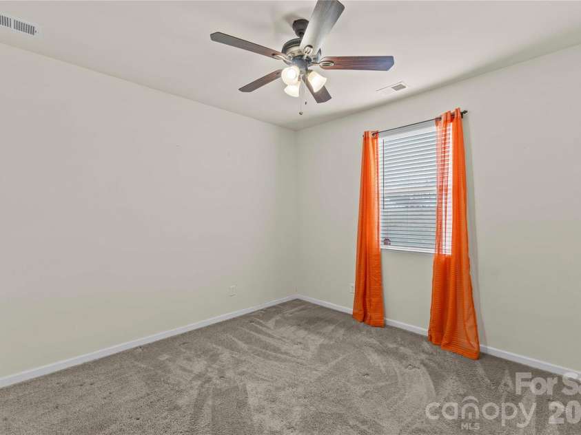 7512 Meridale Forest Drive, Charlotte, NC 28269.  MLS# CAR4346569, YatesRealty ID 12014. Guest Bedroom on Main Level