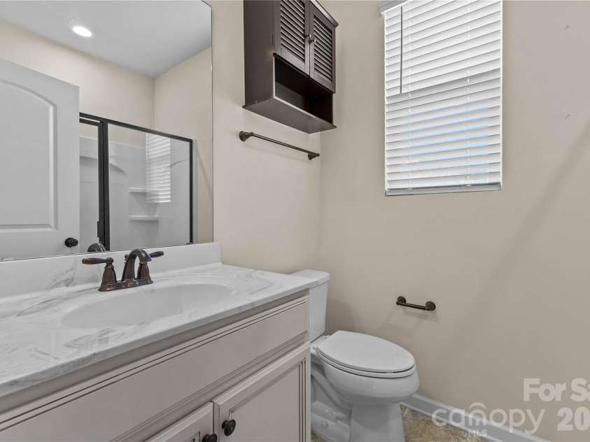 7512 Meridale Forest Drive, Charlotte, NC 28269.  MLS# CAR4346569, YatesRealty ID 12014. Guest Bedroom w/Private Bath