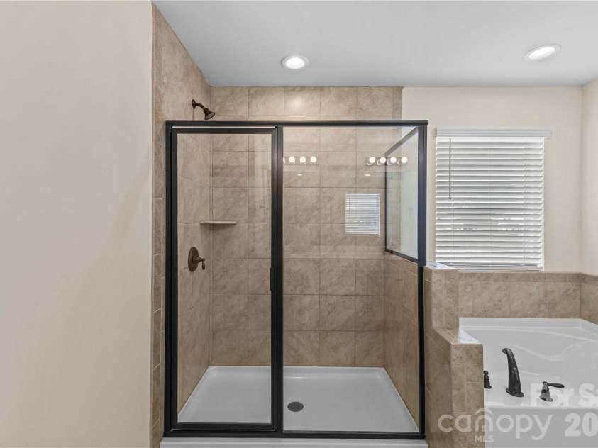 7512 Meridale Forest Drive, Charlotte, NC 28269.  MLS# CAR4346569, YatesRealty ID 12014. Primary Bath w/Stand Alone Shower