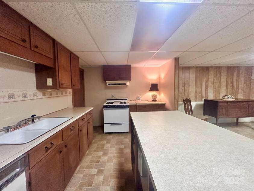 16480 Indian Mound Road, Norwood, NC 28128.  MLS# CAR4208189, YatesRealty ID 12016. Basement Kitchen