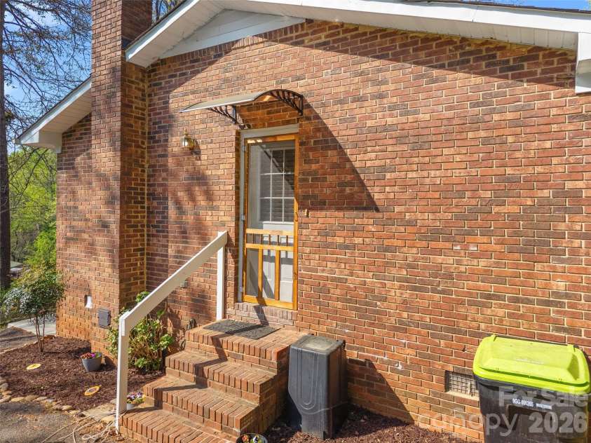 585 Peak Street, Columbus, NC 28722.  MLS# CAR4365398, YatesRealty ID 12017. Side entrance opens right into kitchen