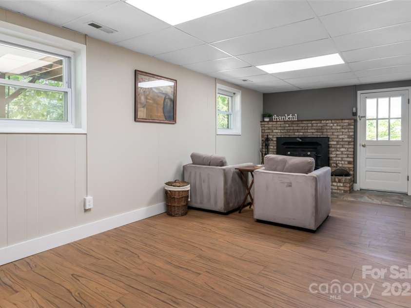 12 Deerwood Drive, Asheville, NC 28805.  MLS# CAR4253736, YatesRealty ID 12018. Wood Burning Stove