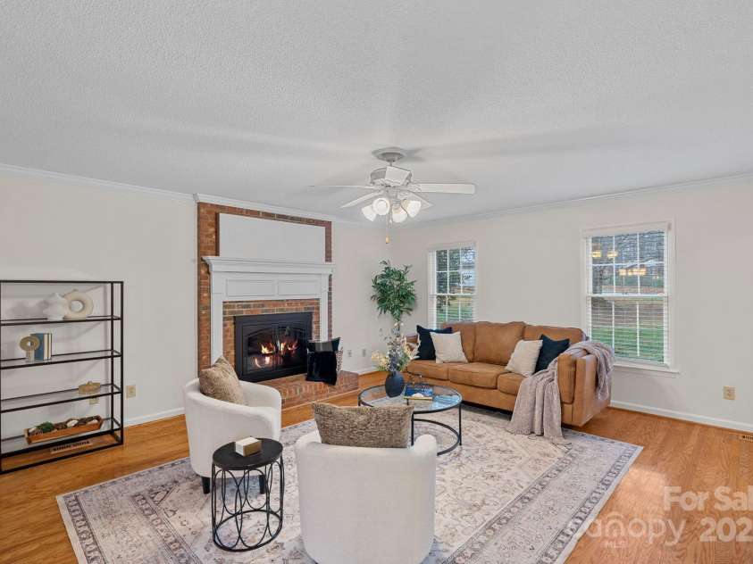 2730 Tiffany Drive, Rock Hill, SC 29732.  MLS# CAR4327115, YatesRealty ID 12020. Gas fireplace with brick surround.