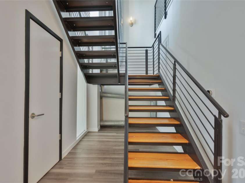 3123 Davidson Street, Charlotte, NC 28205.  MLS# CAR4341241, YatesRealty ID 12024. Main Level Stairs & Laundry Closet 