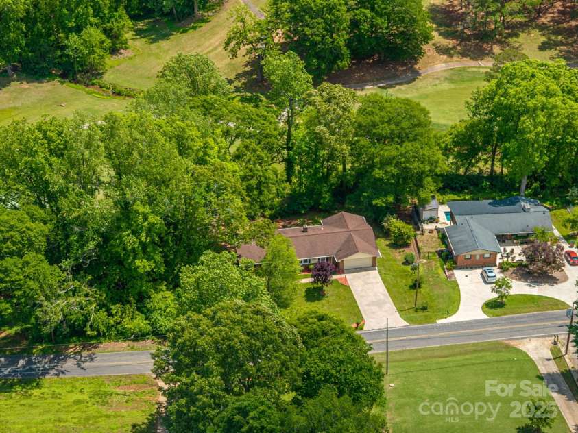 227 Country Club Circle, Shelby, NC 28150.  MLS# CAR4256011, YatesRealty ID 12032. Aerial view of this awesome brick ranch and hole #15 at CCC.