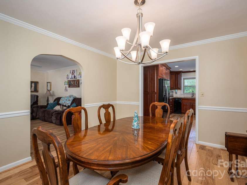 227 Country Club Circle, Shelby, NC 28150.  MLS# CAR4256011, YatesRealty ID 12032. The dining room is nestled between the living room and kitchen.