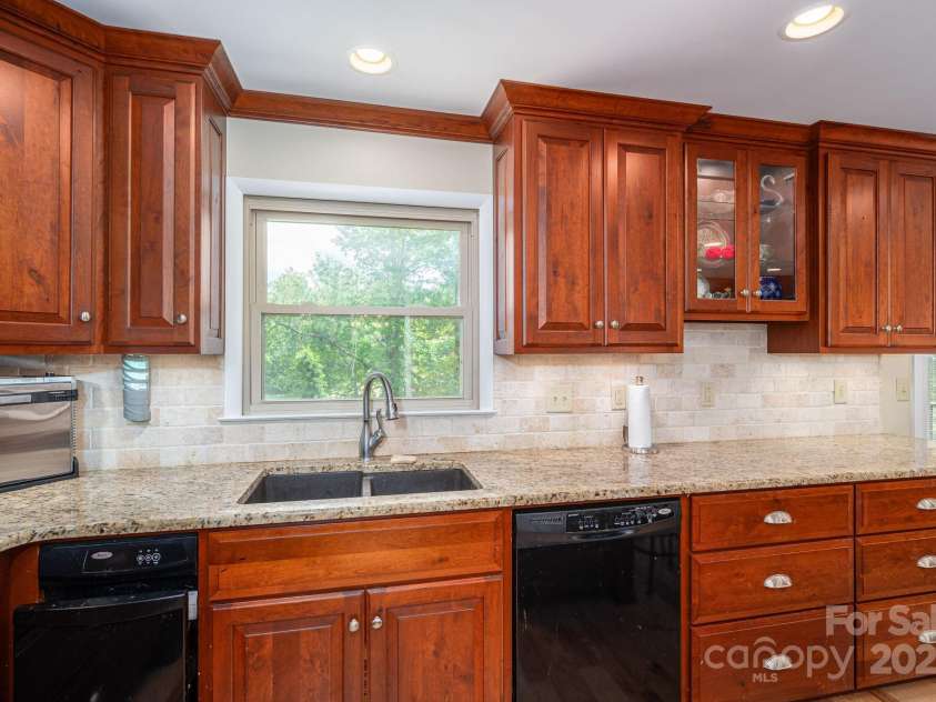 227 Country Club Circle, Shelby, NC 28150.  MLS# CAR4256011, YatesRealty ID 12032. The recently updated kitchen has recessed lighting, custom cabinets and granite countertops.
