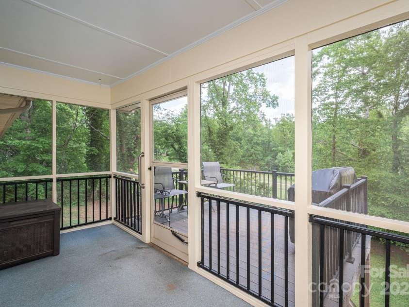 227 Country Club Circle, Shelby, NC 28150.  MLS# CAR4256011, YatesRealty ID 12032. The screen porch leads to another outdoor area...