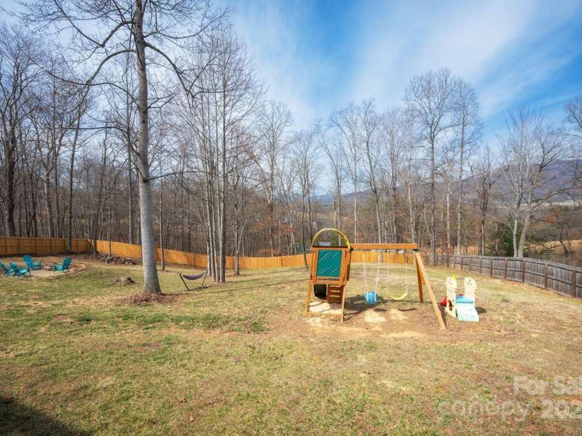 75 Dry Ridge, Canton, NC 28716.  MLS# CAR4232020, YatesRealty ID 12034. Spacious Backyard with Fire Pit and Play Area