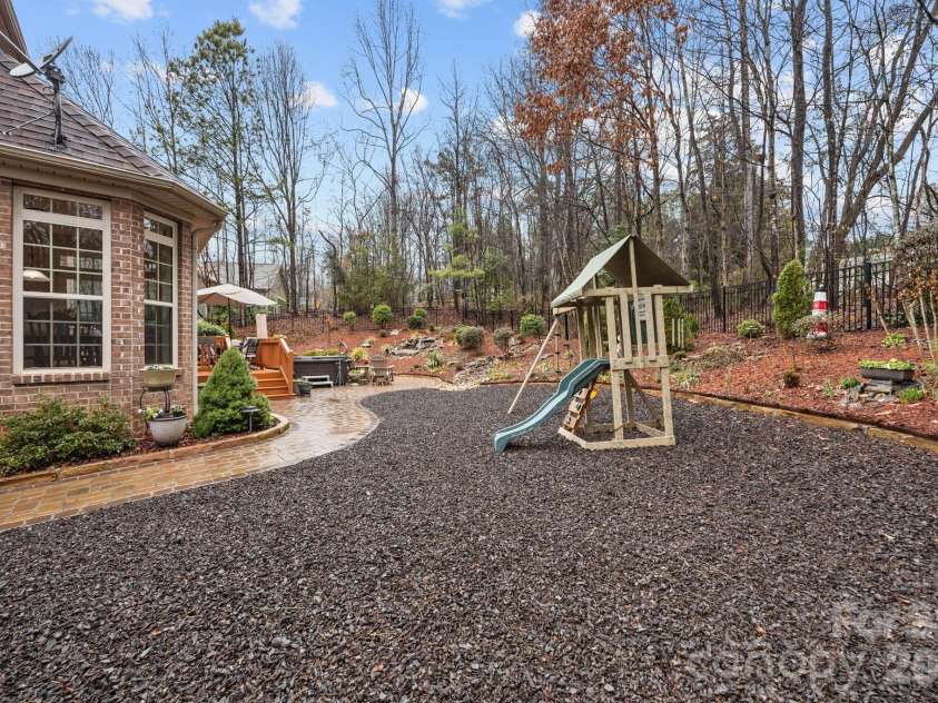 7717 Cottonwood Drive, Denver, NC 28037.  MLS# CAR4352236, YatesRealty ID 12034. Backyard features rubber mulch play area