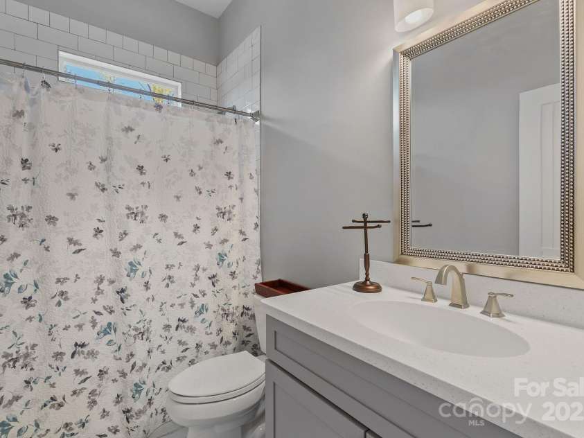 3511 Chimney Rock Road, Hendersonville, NC 28792.  MLS# CAR4242535, YatesRealty ID 12035. Second full bath between bedroom 2 and 3