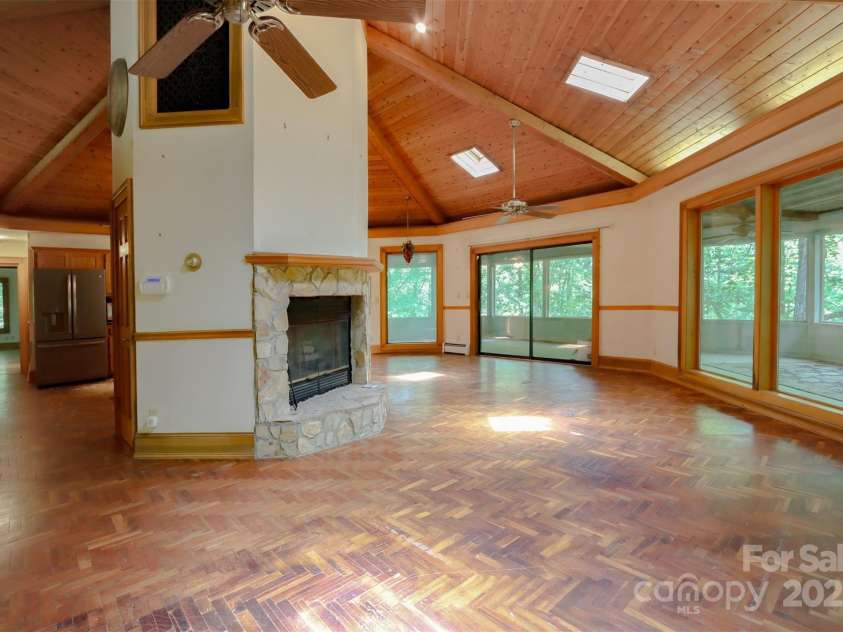 388 Island Creek Road, Lake Lure, NC 28746.  MLS# CAR4062749, YatesRealty ID 1204. Great room with fireplace