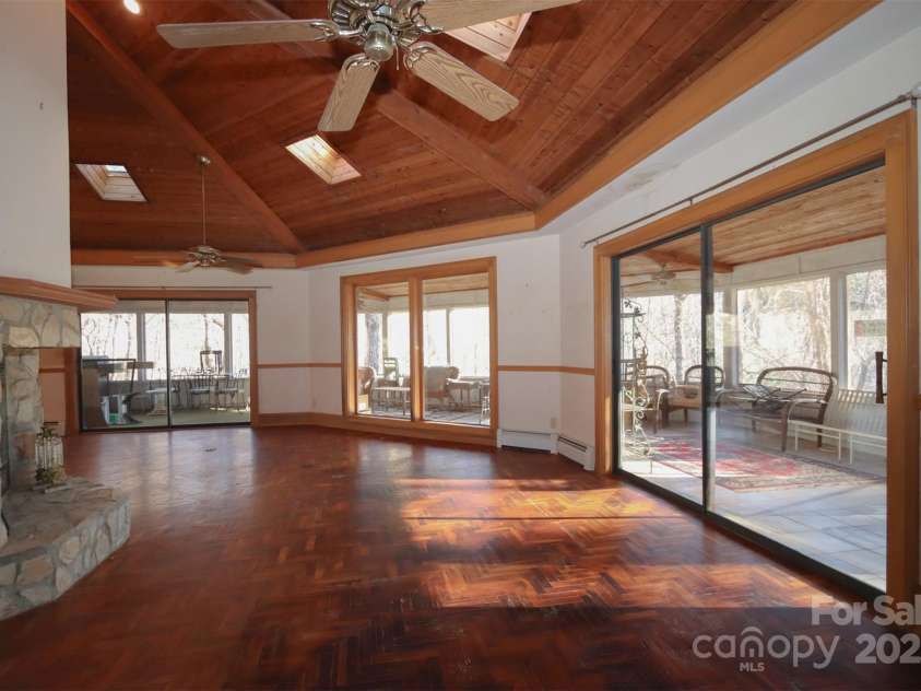 388 Island Creek Road, Lake Lure, NC 28746.  MLS# CAR4062749, YatesRealty ID 1204. Living Room with fireplace main house