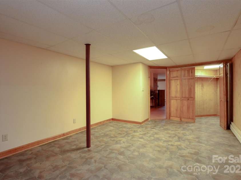 388 Island Creek Road, Lake Lure, NC 28746.  MLS# CAR4062749, YatesRealty ID 1204. Lower level flex space