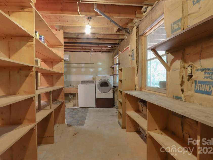 388 Island Creek Road, Lake Lure, NC 28746.  MLS# CAR4062749, YatesRealty ID 1204. Storage and laundry lower level