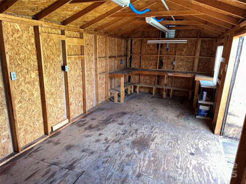 396 Pitts School Road, Concord, NC 28027.  MLS# CAR4251214, YatesRealty ID 12047. Storage building with double door entry