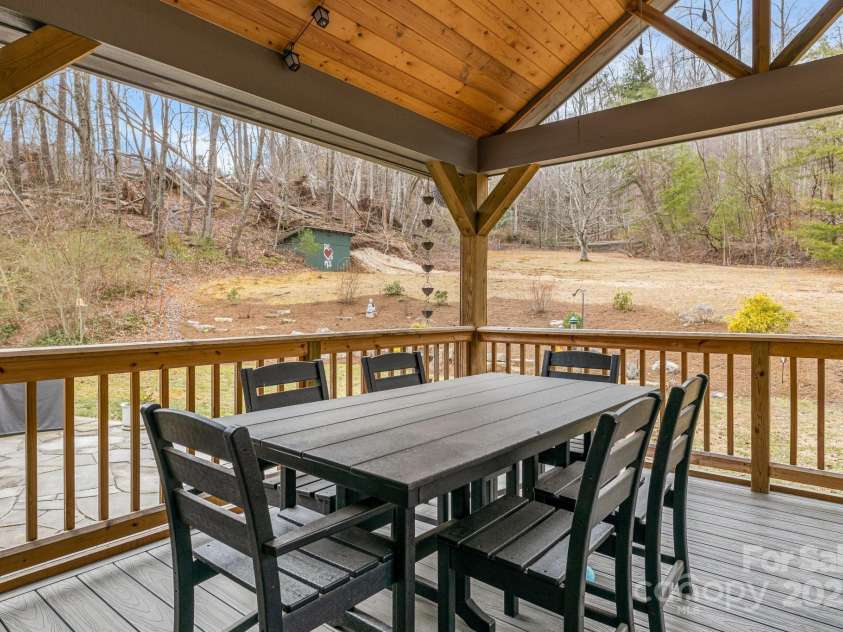 53 Jump Cove Road, Weaverville, NC 28787.  MLS# CAR4209397, YatesRealty ID 12056. Covered and Private Back Deck for enjoying the back yard.