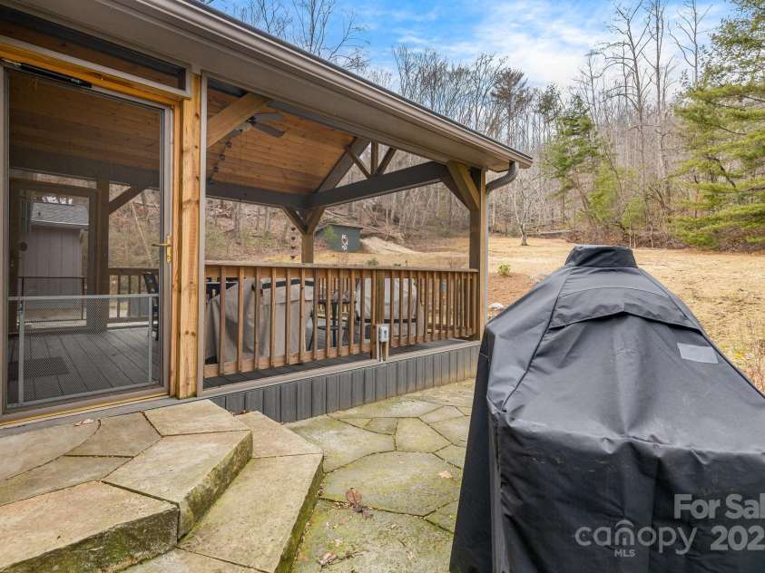 53 Jump Cove Road, Weaverville, NC 28787.  MLS# CAR4209397, YatesRealty ID 12056. Covered Porch overlooking spacious back yard