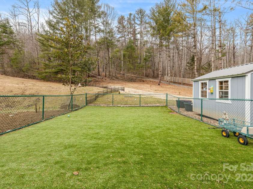 53 Jump Cove Road, Weaverville, NC 28787.  MLS# CAR4209397, YatesRealty ID 12056. Separate Fenced Pet Area with She Shed