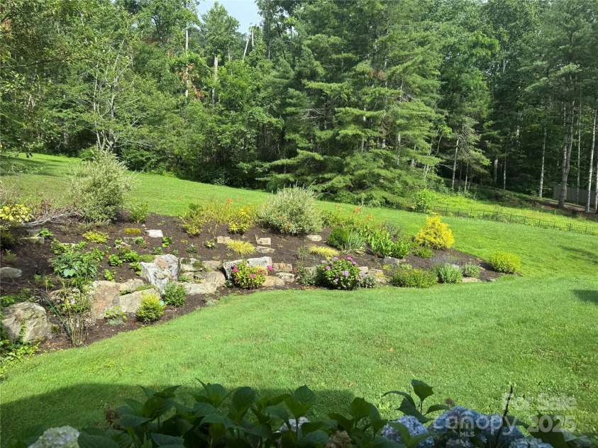 53 Jump Cove Road, Weaverville, NC 28787.  MLS# CAR4209397, YatesRealty ID 12056. Serene Backyard