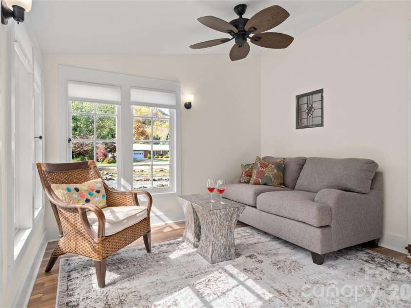 125 Timberline Drive, Maggie Valley, NC 28751.  MLS# CAR4365307, YatesRealty ID 12058. Sun Room with wrap around windows