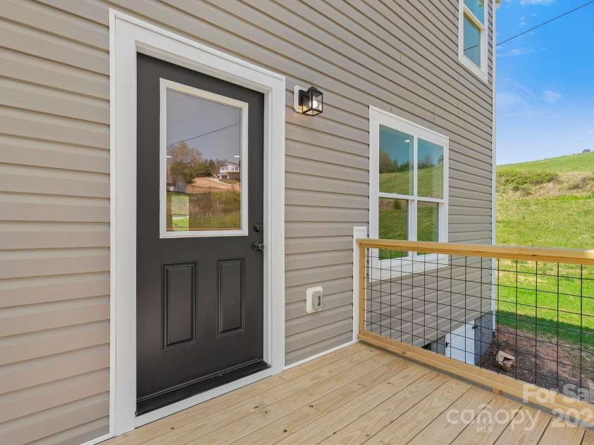 208 Sycamore Farm Road, Leicester, NC 28748.  MLS# CAR4237667, YatesRealty ID 12064. Back deck