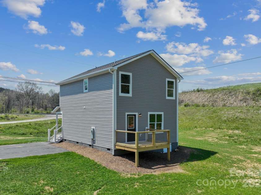 208 Sycamore Farm Road, Leicester, NC 28748.  MLS# CAR4237667, YatesRealty ID 12064. Back of home/back deck
