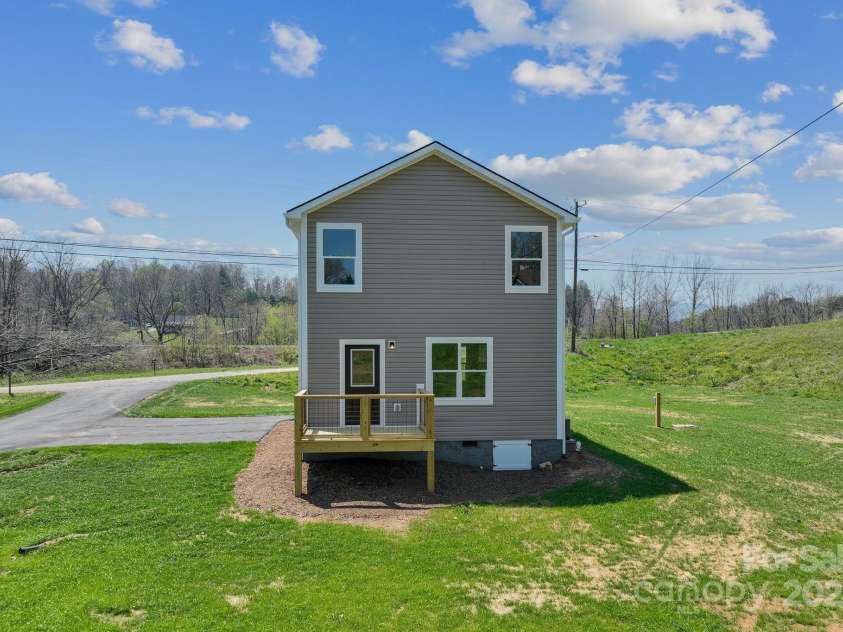 208 Sycamore Farm Road, Leicester, NC 28748.  MLS# CAR4237667, YatesRealty ID 12064. Back of home/back deck