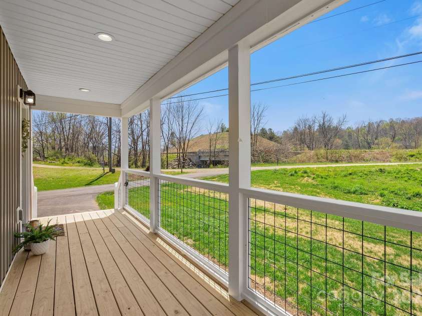 208 Sycamore Farm Road, Leicester, NC 28748.  MLS# CAR4237667, YatesRealty ID 12064. Covered Front Porch
