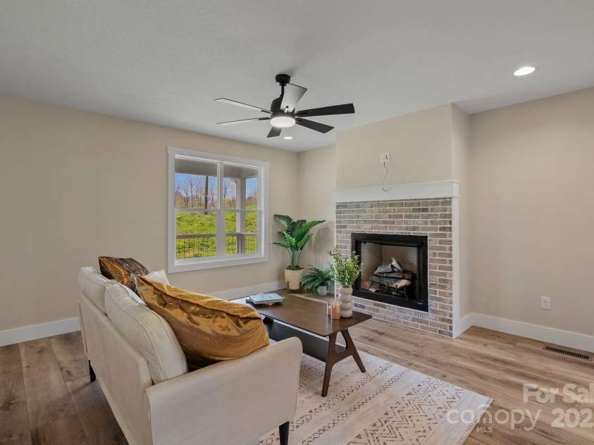 208 Sycamore Farm Road, Leicester, NC 28748.  MLS# CAR4237667, YatesRealty ID 12064. Living room w/gas log fireplace