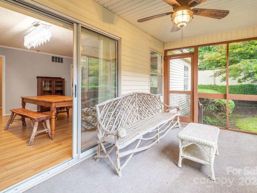 124 Exeter Court, Hendersonville, NC 28791.  MLS# CAR4159638, YatesRealty ID 12066. Covered Screen Porch with Ceiling Fan