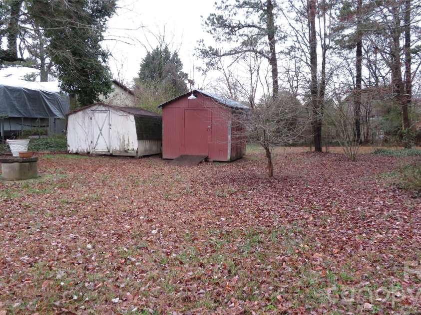 3622 Union Road, Gastonia, NC 28056.  MLS# CAR4346544, YatesRealty ID 12067. Backyard w/ storage  sheds