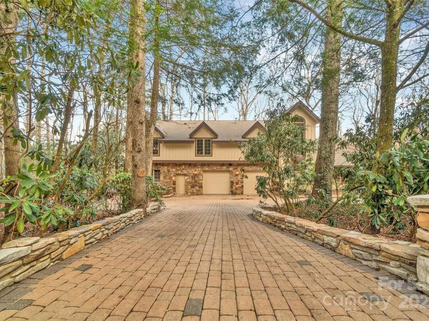 562 West Club Boulevard, Lake Toxaway, NC 28747.  MLS# CAR4199636, YatesRealty ID 1207. Flat Driveway
