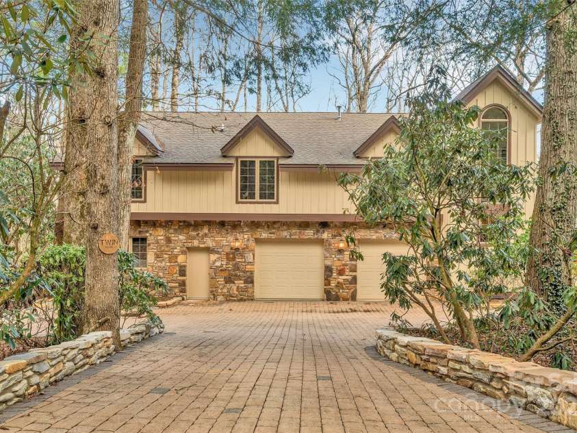 562 West Club Boulevard, Lake Toxaway, NC 28747.  MLS# CAR4199636, YatesRealty ID 1207. Pavered Drive