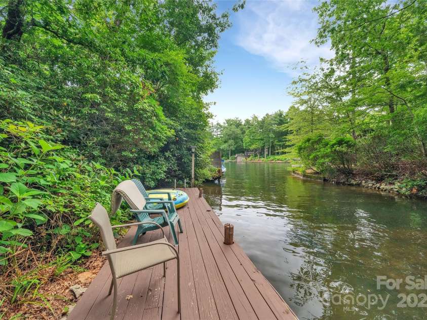 562 West Club Boulevard, Lake Toxaway, NC 28747.  MLS# CAR4199636, YatesRealty ID 1207. Private Dock overlooking Lake Toxaway