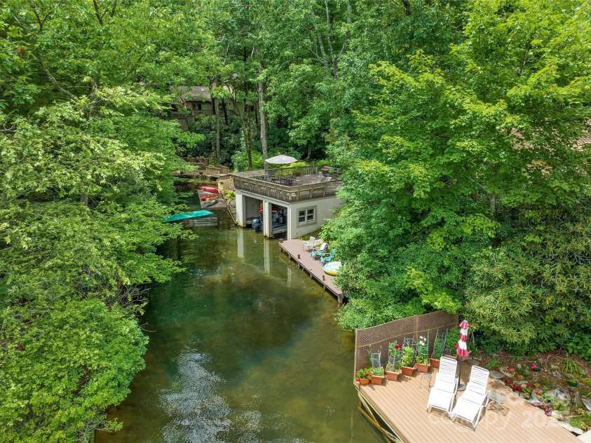 562 West Club Boulevard, Lake Toxaway, NC 28747.  MLS# CAR4199636, YatesRealty ID 1207. Two stall Boathouse with separate private dock