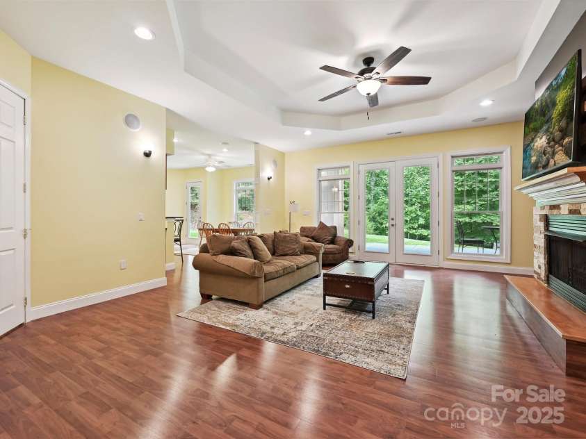 1140 Fern Hill Road, Mooresville, NC 28117.  MLS# CAR4255290, YatesRealty ID 12085. Basement great room with backyard view and covered patio